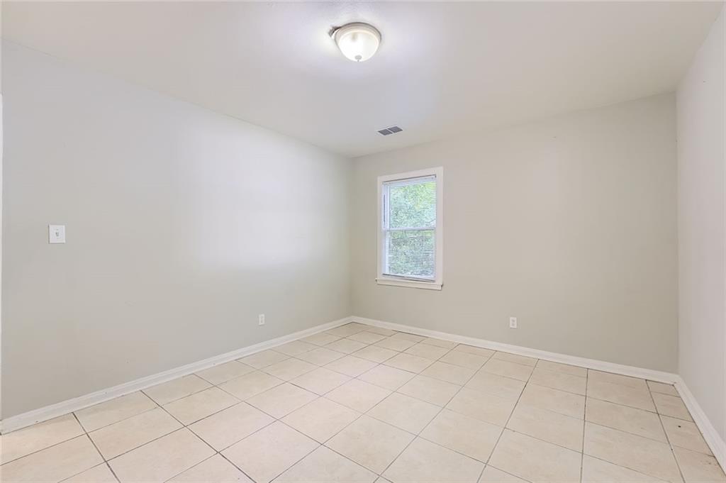 2275 Old Spring Road Smyrna, GA 30080 - Photo 22 of 28 an empty room with a empty space and window