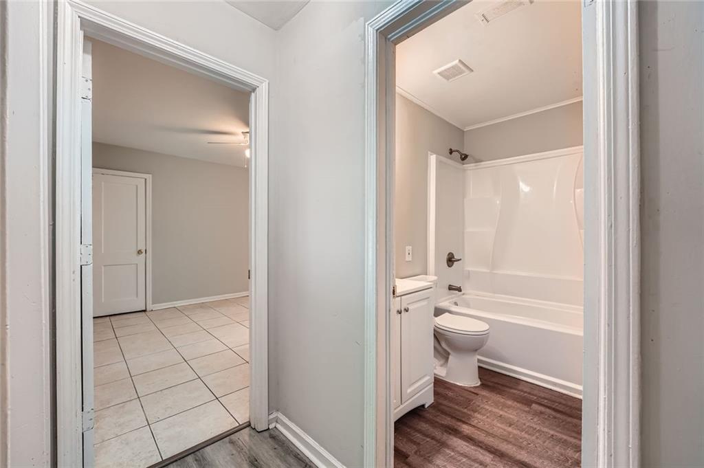 2275 Old Spring Road Smyrna, GA 30080 - Photo 24 of 28 a bathroom with a toilet tub and a shower