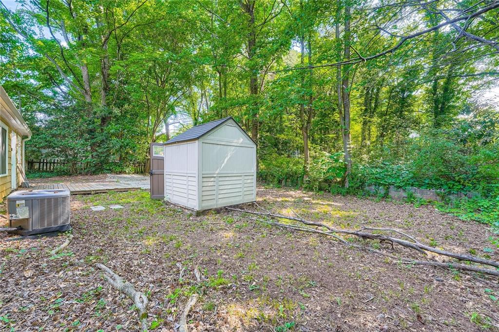 2275 Old Spring Road Smyrna, GA 30080 - Photo 27 of 28 a backyard of a house with yard and trampoline