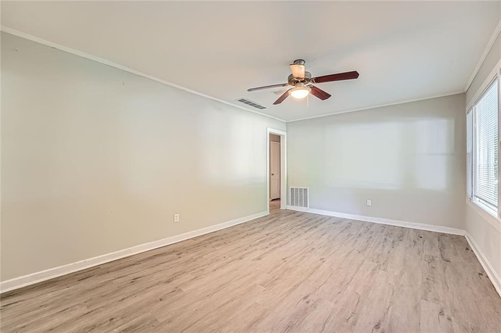 2275 Old Spring Road Smyrna, GA 30080 - Photo 5 of 28 wooden floor in an empty room with a window