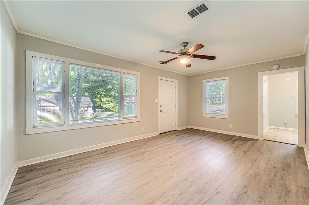 2275 Old Spring Road Smyrna, GA 30080 - Photo 7 of 28 an empty room with wooden floor and windows