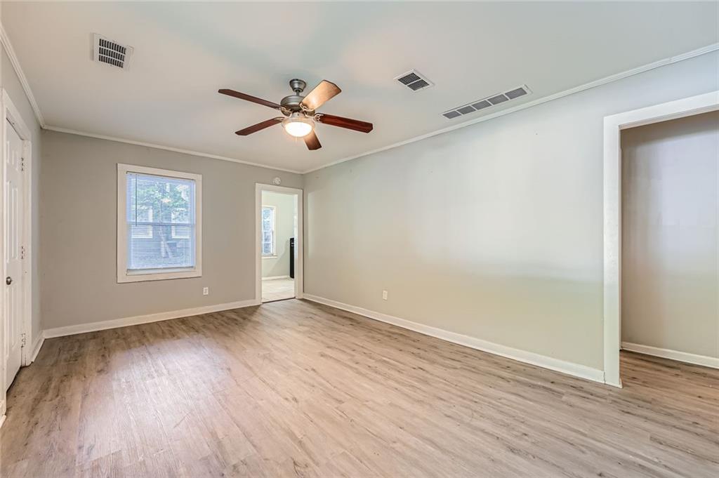 2275 Old Spring Road Smyrna, GA 30080 - Photo 8 of 28 wooden floor in an empty room with a window