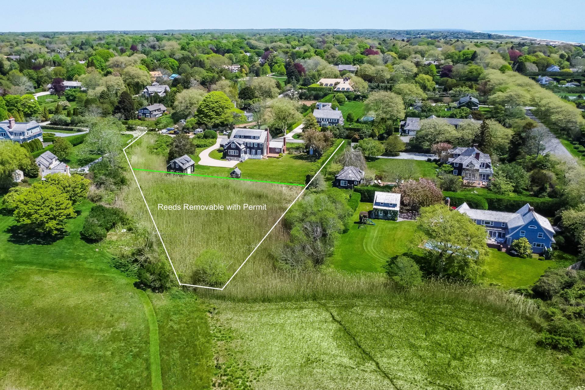 15 Jones Road East Hampton, NY 11937 - Photo 11 of 16 an aerial view of residential houses with outdoor space and trees