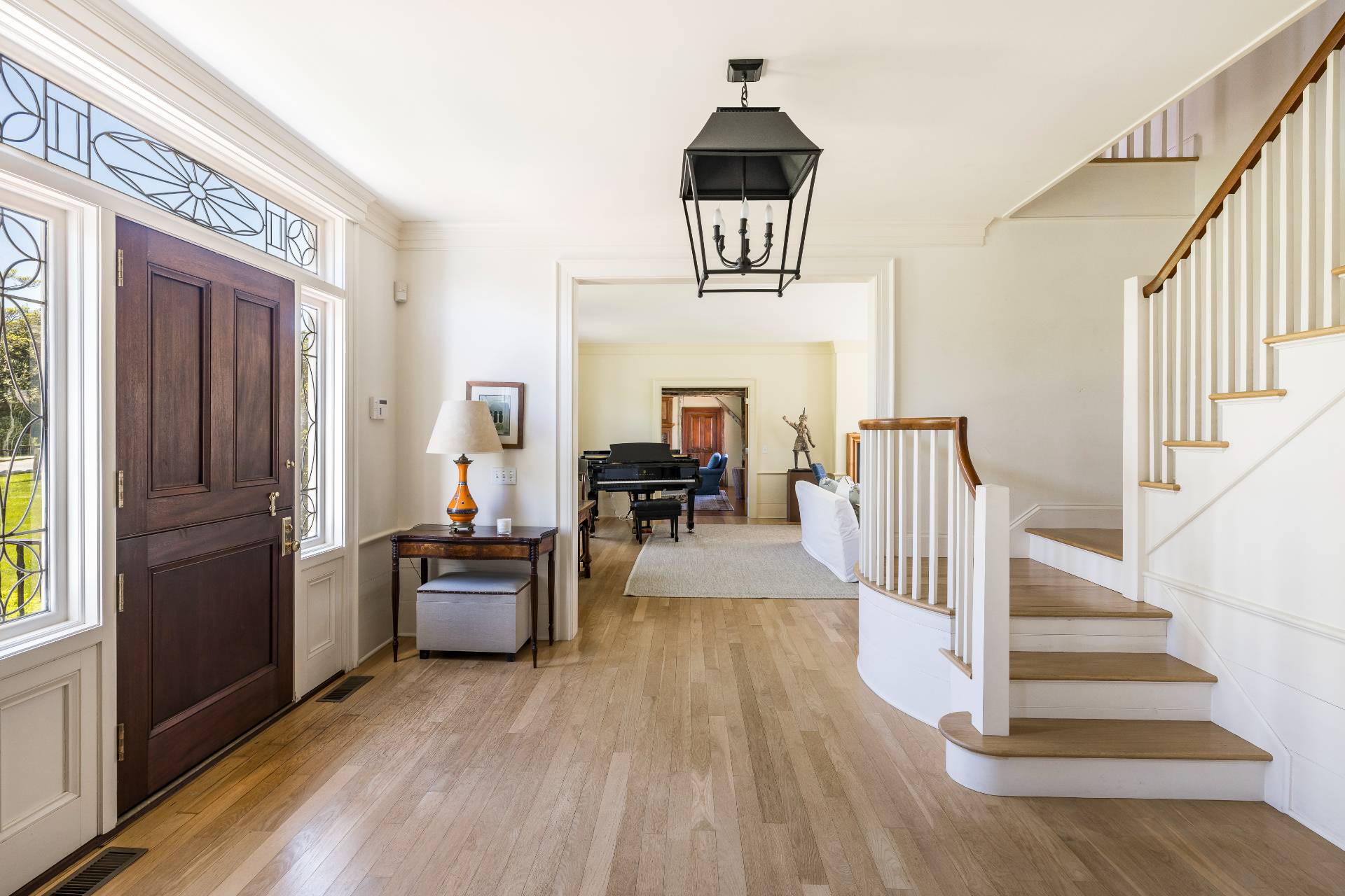 15 Jones Road East Hampton, NY 11937 - Photo 12 of 16 a view of a hallway view with wooden floor and staircase