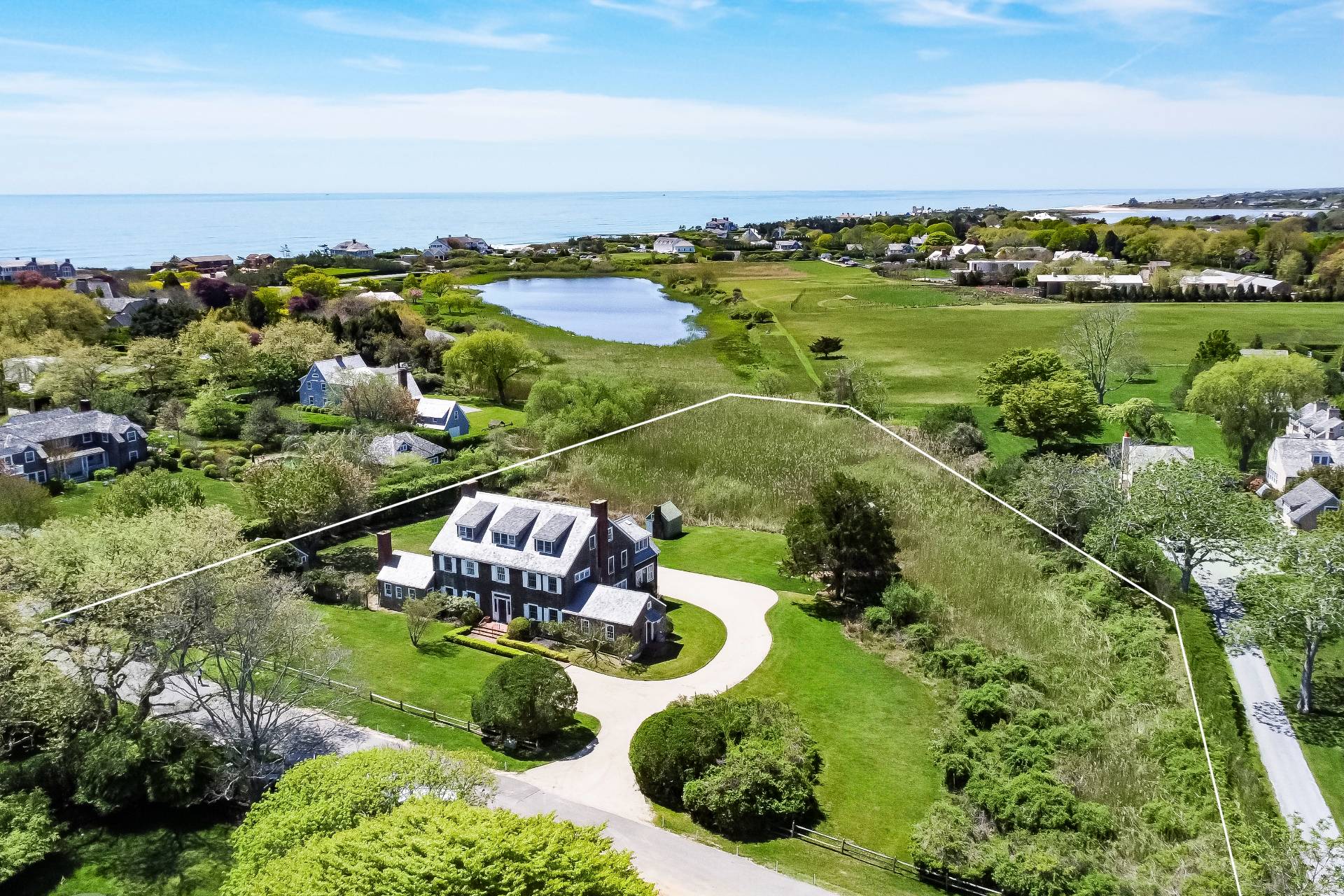 15 Jones Road East Hampton, NY 11937 - Photo 2 of 16 an aerial view of a houses with a lake view