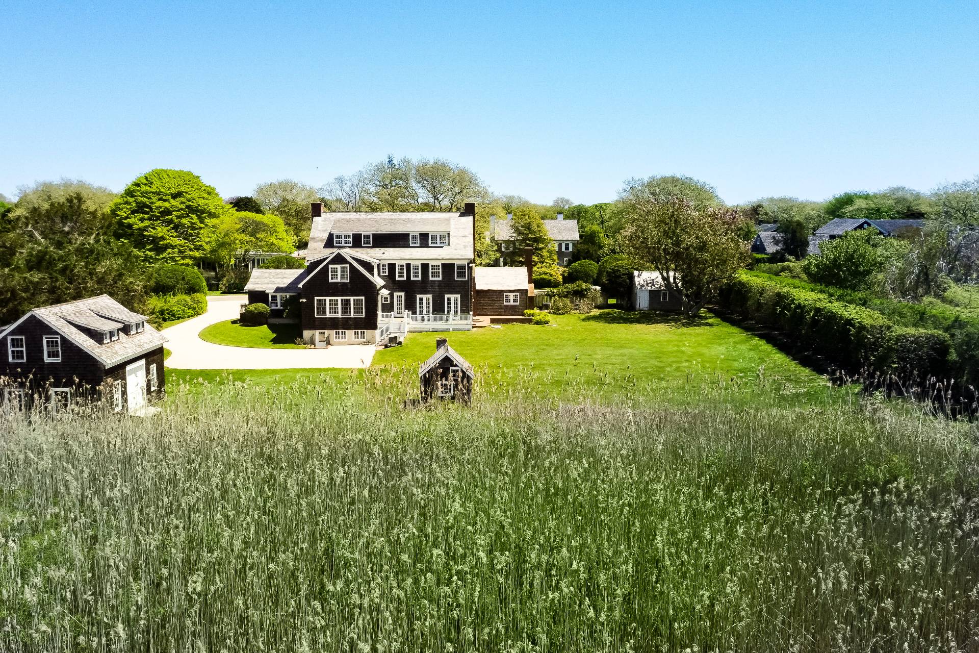 15 Jones Road East Hampton, NY 11937 - Photo 3 of 16 a view of a house with swimming pool and sitting area