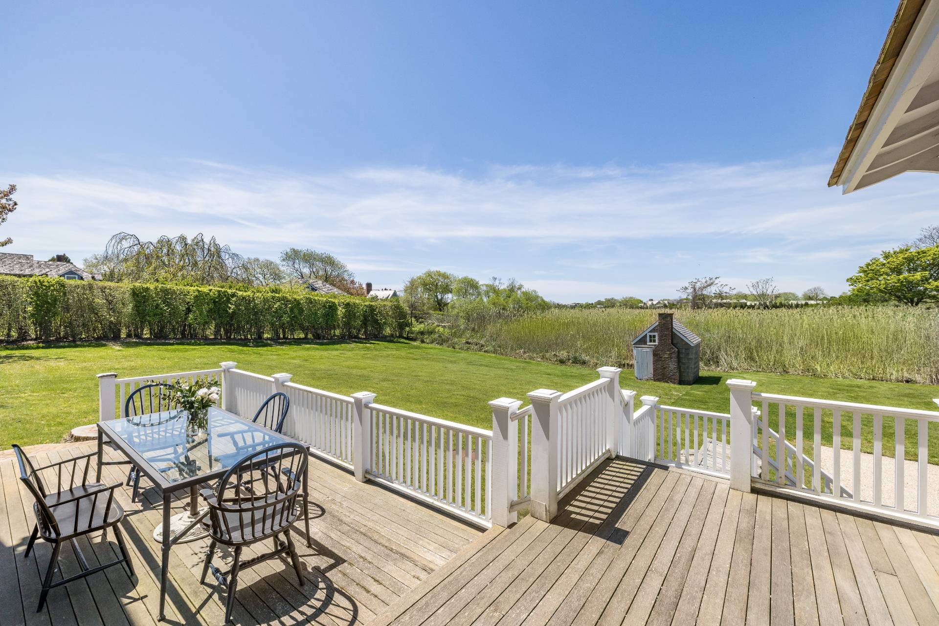 15 Jones Road East Hampton, NY 11937 - Photo 8 of 16 a view of a lake with couches in the patio