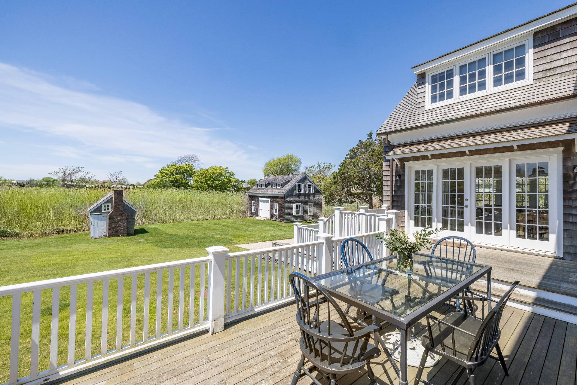 15 Jones Road East Hampton, NY 11937 - Photo 9 of 16 a view of a house with backyard and sitting area