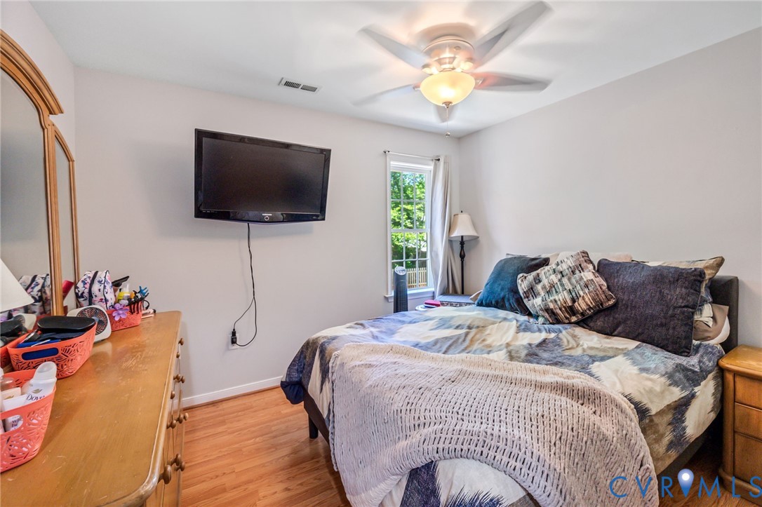 3218 Rimswell Court Midlothian, VA 23112 - Photo 21 of 32 Bedroom featuring light wood-style floors, baseboa