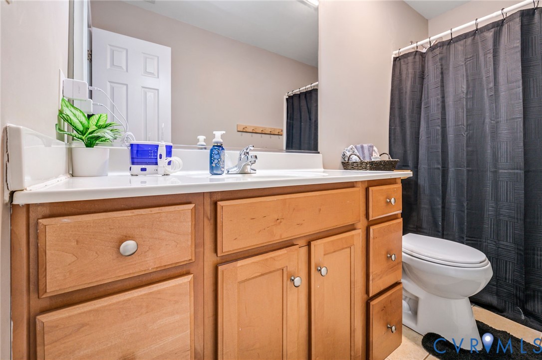 3218 Rimswell Court Midlothian, VA 23112 - Photo 24 of 32 Full bathroom with toilet, vanity, and a shower wi