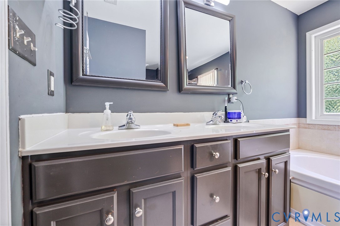 3218 Rimswell Court Midlothian, VA 23112 - Photo 28 of 32 Bathroom featuring double vanity and a garden tub