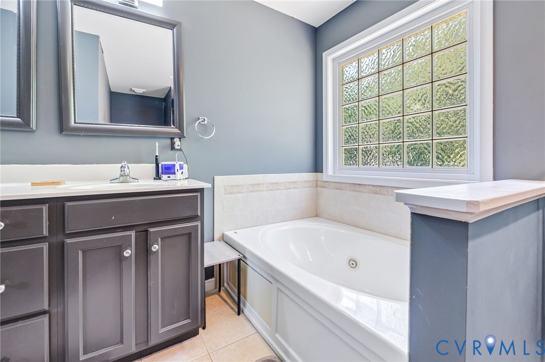 3218 Rimswell Court Midlothian, VA 23112 - Photo 29 of 32 Full bathroom featuring vanity, a whirlpool tub, a
