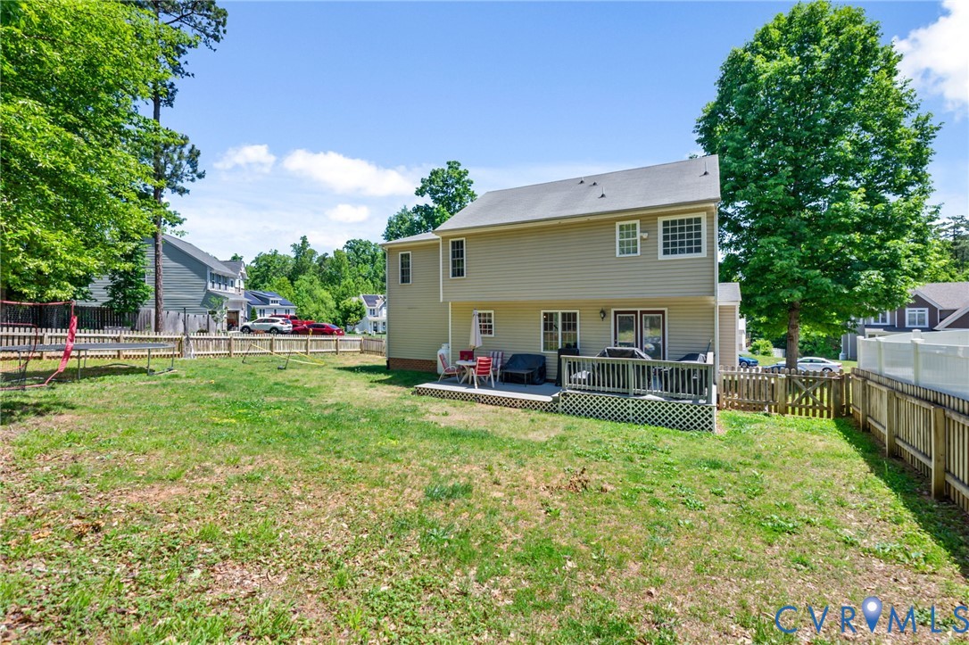 3218 Rimswell Court Midlothian, VA 23112 - Photo 31 of 32 Rear view of house featuring a trampoline and a de