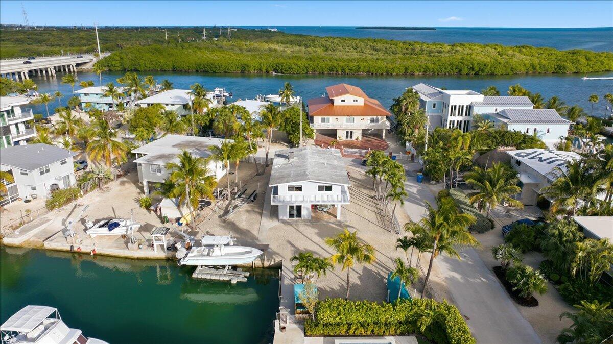 203 Bessie Road Tavernier, FL 33070 - Photo 8 of 42 a view of a city with lawn chairs
