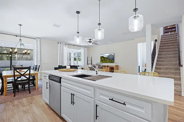 a kitchen with a sink and stove
