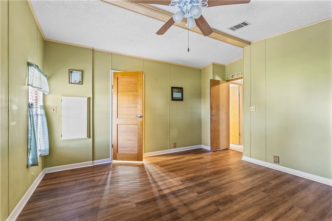 7635 Blackhawk Road Micco, FL 32976 - Photo 13 of 30 a view of livingroom with hardwood floor and window