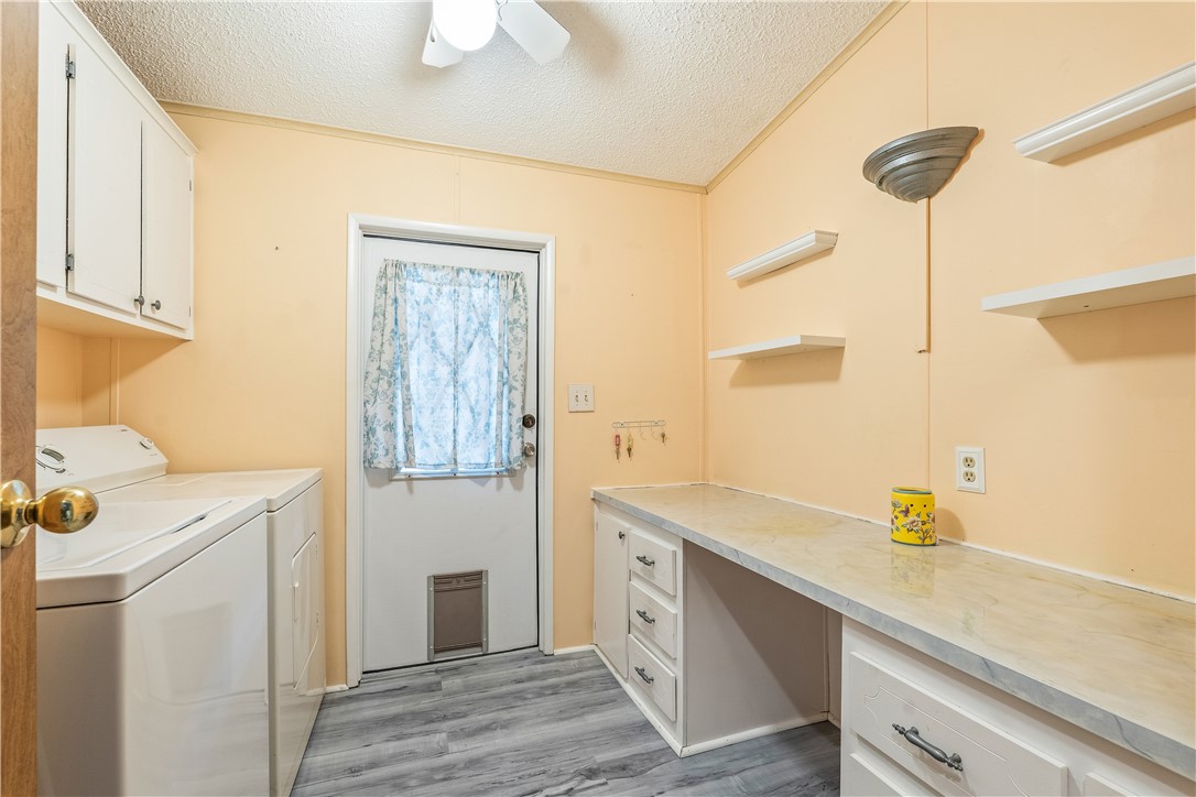 7635 Blackhawk Road Micco, FL 32976 - Photo 18 of 30 a utility room with a sink dryer and washer