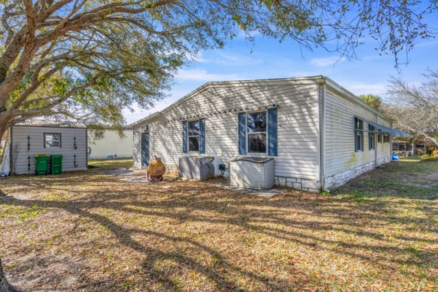 7635 Blackhawk Road Micco, FL 32976 - Photo 21 of 30 a view of a house with a yard