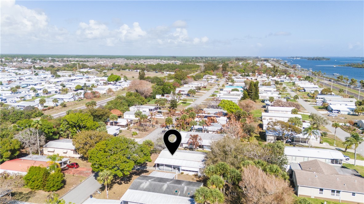 7635 Blackhawk Road Micco, FL 32976 - Photo 29 of 30 an aerial view of residential building and lake