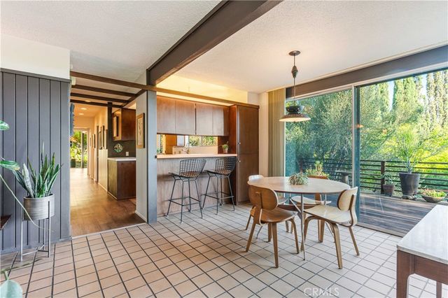 a outdoor space with chairs a table and chairs