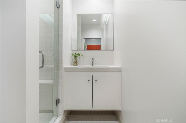 a bathroom with a sink and mirror