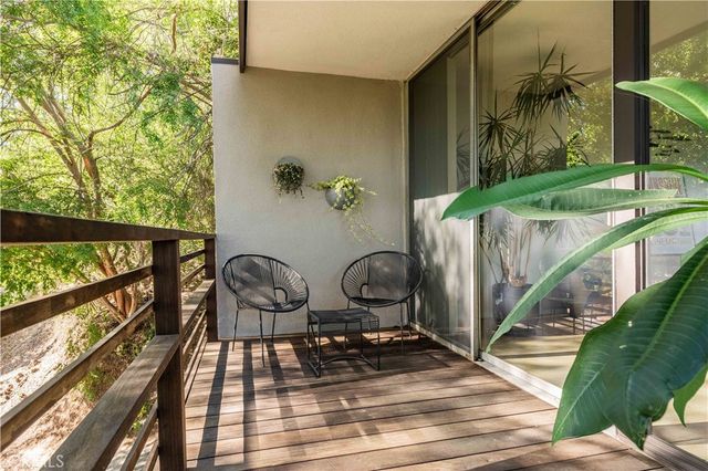 a view of deck with wooden floor and outdoor seating