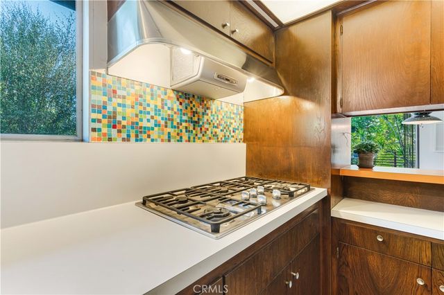 a kitchen view with a stove and a table