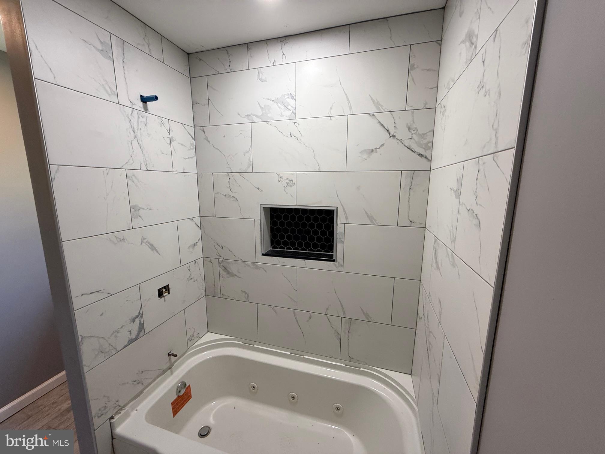 57 Pine Street Beverly, NJ 08010 - Photo 4 of 9 a bathroom with a bathtub