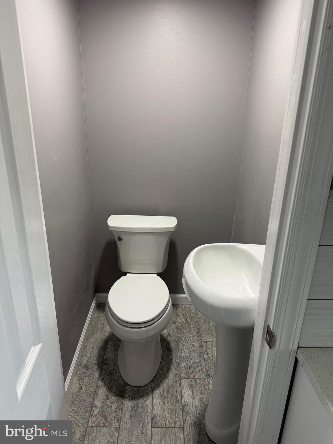 57 Pine Street Beverly, NJ 08010 - Photo 9 of 9 a white toilet sitting next to a shower