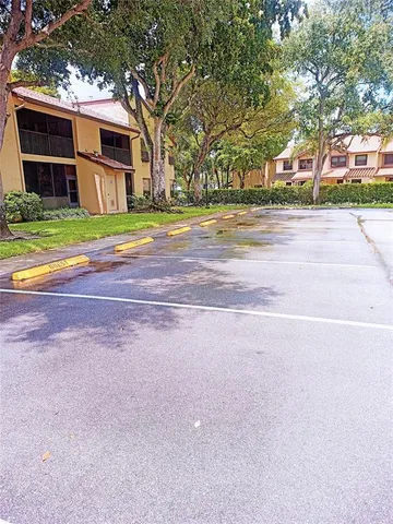 a view of a lake with houses in the back