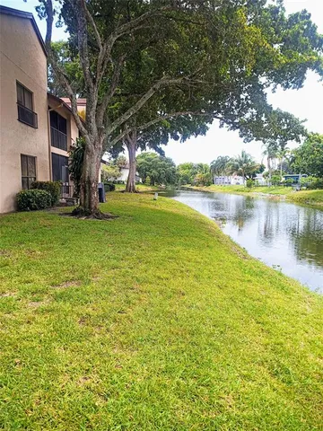a view of a lake with a houses in the background