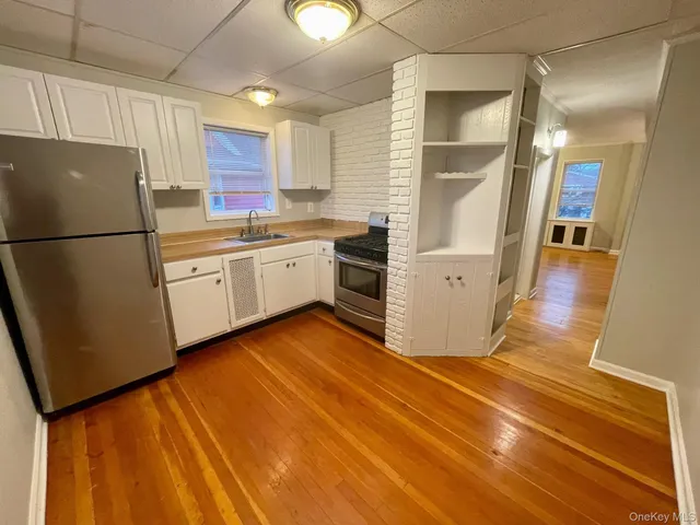 a kitchen with a refrigerator a sink and dishwasher