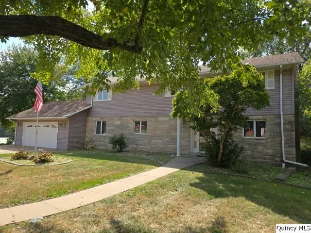 a house view with a garden space