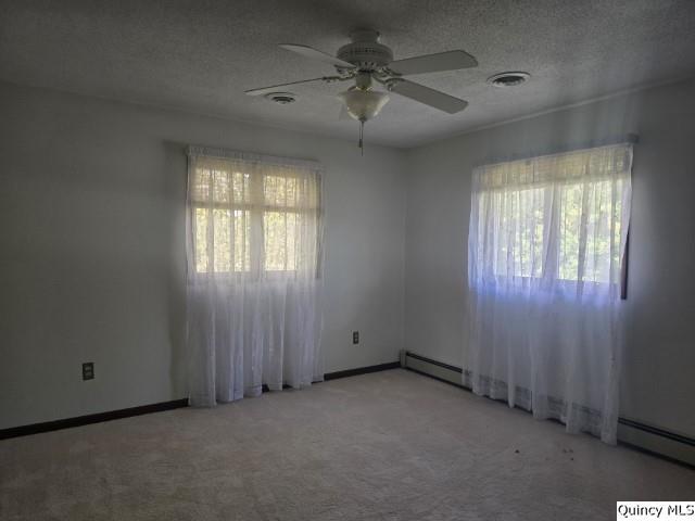 1797 East Co Road 1540 Carthage, IL 62321 - Photo 17 of 36 an empty room with windows and fan