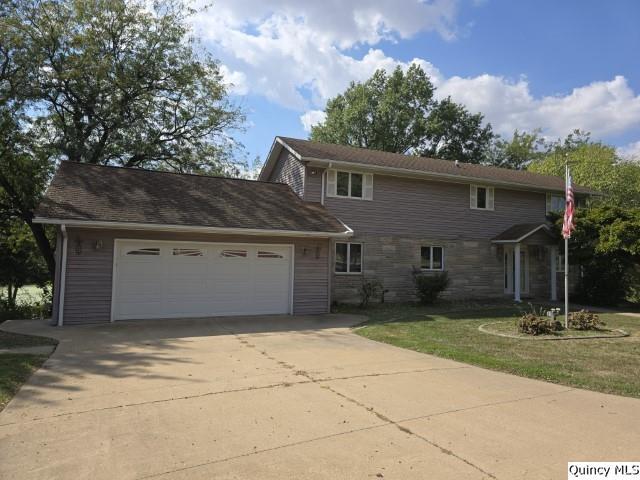 1797 East Co Road 1540 Carthage, IL 62321 - Photo 32 of 36 front view of a house with a patio
