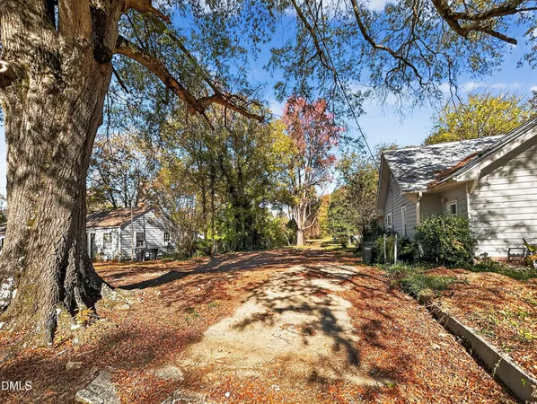 a front view of a house with a road