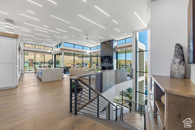 3558 South Cypress Road Hurricane, UT 84737 - Photo 26 of 57 Corridor featuring floor to ceiling windows, light hardwood / wood-style flooring, and plenty of natural light