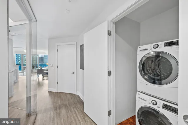 a view of a hallway with washer and dryer