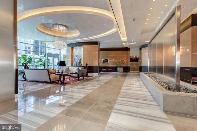 a lobby with furniture and a large window