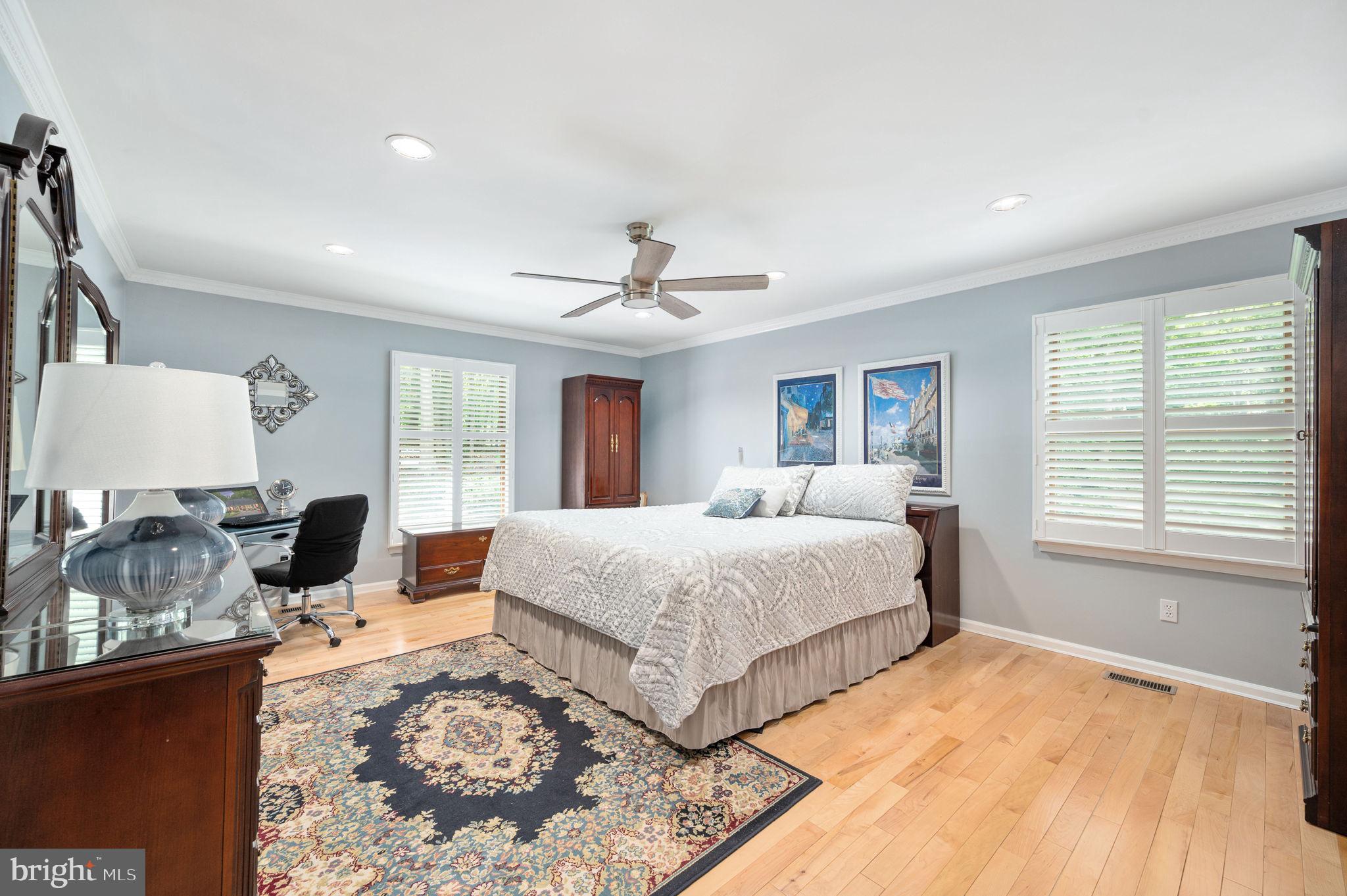 11105 Waddell Road Bumpass, VA 23024 - Photo 36 of 76 a spacious bedroom with a large bed and a window