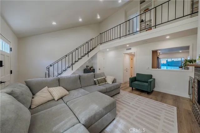 a kitchen with stainless steel appliances granite countertop a sink a stove a microwave and cabinets