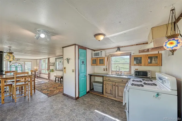 a kitchen with a stove and a refrigerator