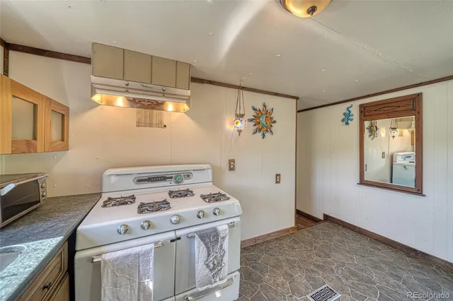 a view of room with window and furniture