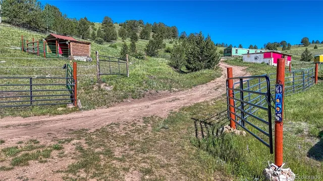 a view of a wooden fence next to a road