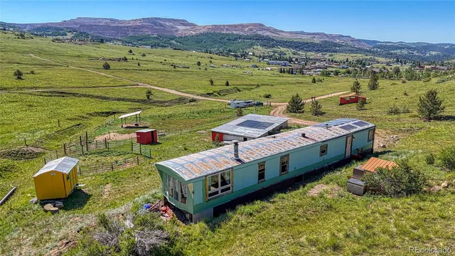 a view of a houses with a yard