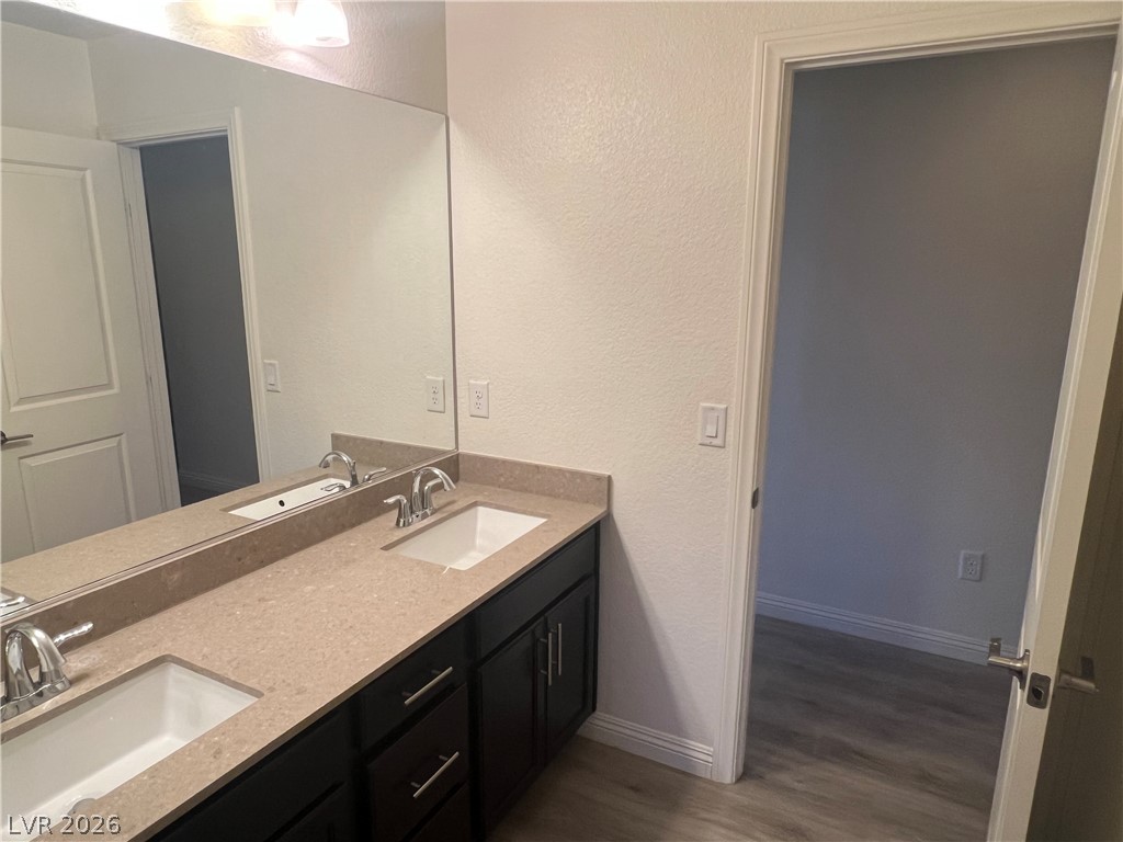 9581 Aberdeen Ridge Court Las Vegas, NV 89148 - Photo 17 of 25 Double vanity with ample counter space and sleek fixtures defines this contemporary bathroom.
