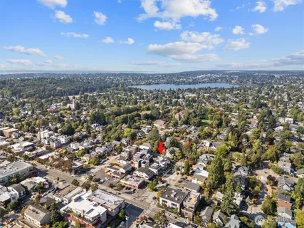 a view of a brick building next to a yard