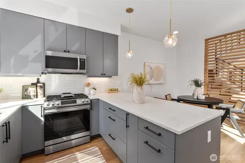 a kitchen with a stove and a sink