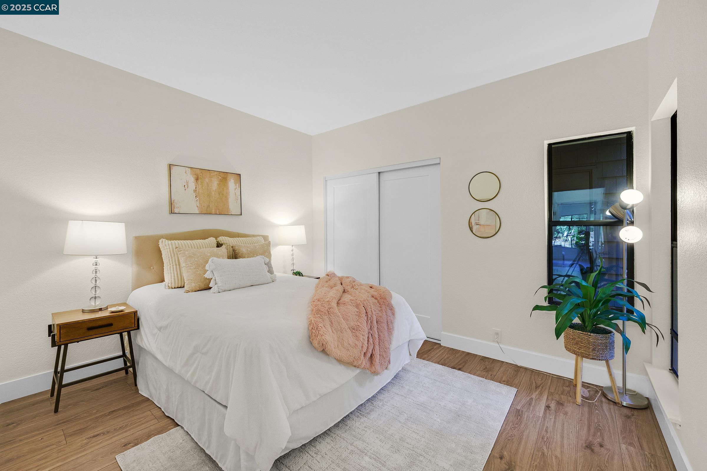 246 Copper Ridge Road San Ramon, CA 94582 - Photo 12 of 41 a bedroom with a bed and a potted plant