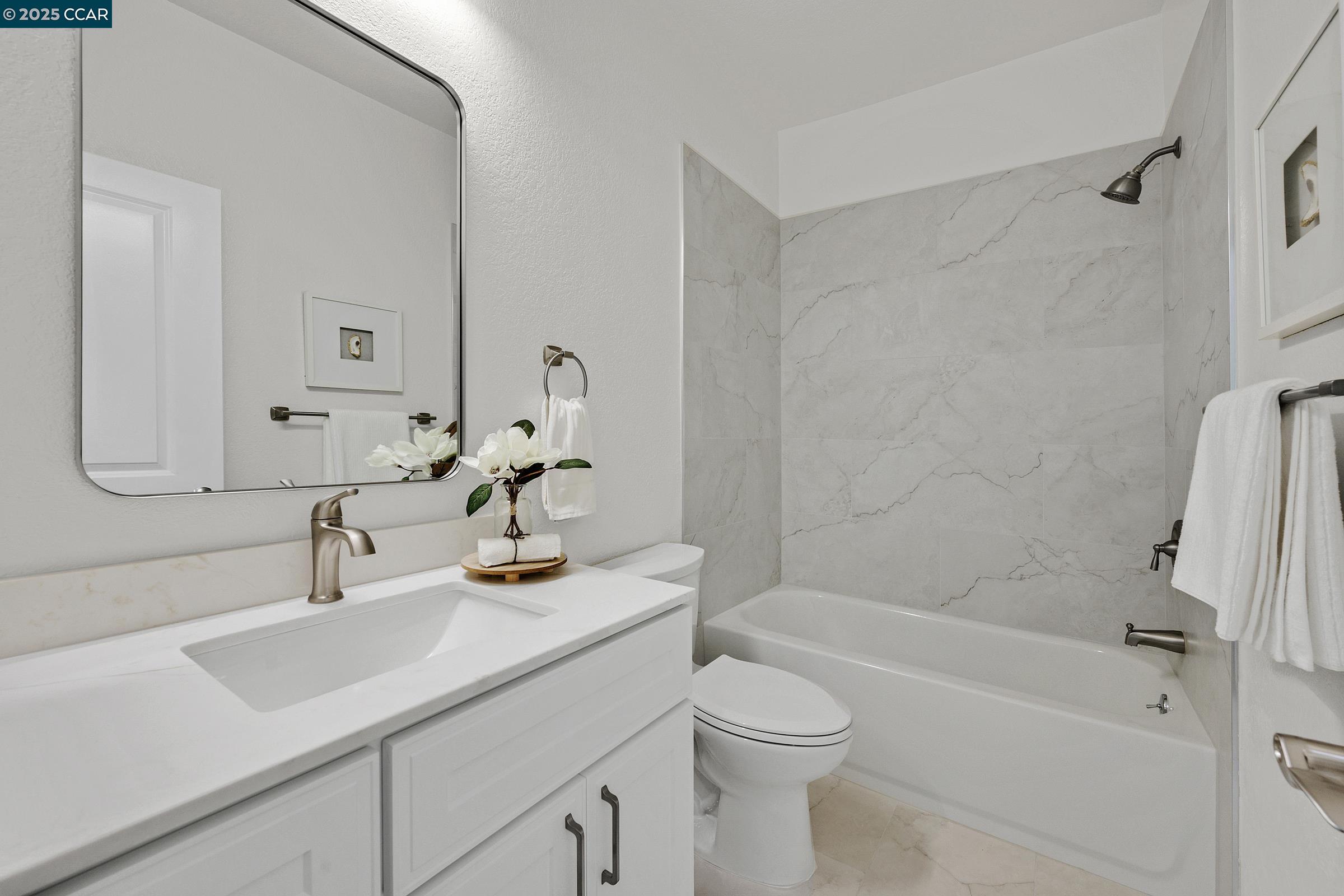 246 Copper Ridge Road San Ramon, CA 94582 - Photo 13 of 41 a bathroom with a sink a toilet and shower